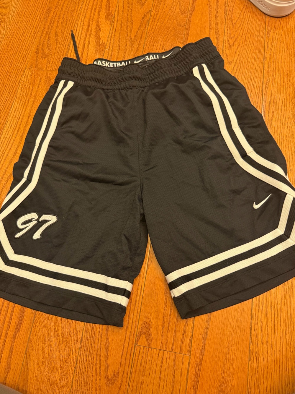 Nike Men’s Black Athletic Basketball Shorts with White Stripes size Small